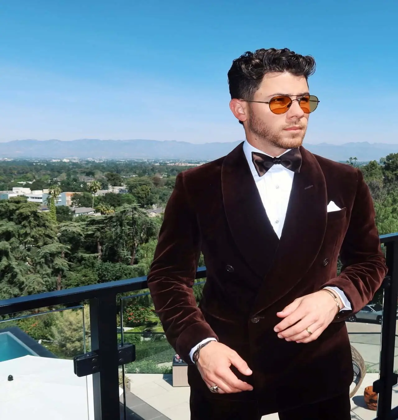 Ealier, Nick cut a dashing figure in a black velvet suit, bowtie and shades at the Oscars. He captioned his carousel post: 